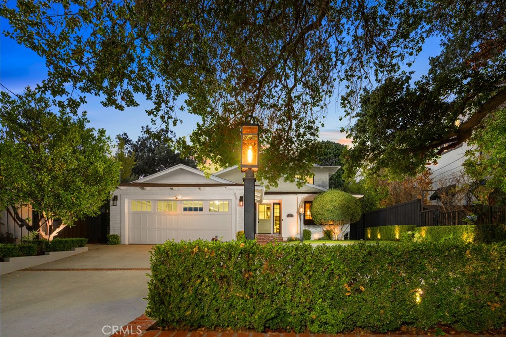 Discover effortless luxury in the heart of Sierra Madre. Restored to perfection in 2018, this immaculate residence invites you to simply move in, unpack, and enjoy. From the moment you step inside, a dramatic two-story foyer sets the tone with soaring vaulted ceilings, neutral designer tones, and wide-plank European oak hardwood floors that flow seamlessly throughout. Sunlight pours through Milgard windows dressed with custom shades, brightening the open living room and chandelier-lit dining area. The chef’s kitchen is a showpiece, boasting a full suite of KitchenAid Café stainless steel appliances, sleek cabinetry, and striking Cosentino Silestone quartz countertops. A three-seat island, illuminated by chic pendants, incorporates Energy Star alarm-activated refrigerator drawers, while a pass-through service window enhances entertaining. Expansive 5-panel aluminum and glass bi-fold lanai doors create a seamless connection to the outdoors, framing serene backyard views. Every detail has been thoughtfully designed—from the custom built-ins in the living room to the maple banquette with storage in the breakfast nook. An artisan wood-burning fireplace with a bespoke mantle provides warmth and charm, while designer baths feature wainscoting, Restoration Hardware vanities, hand-selected wallpaper, and curated lighting. Retreat to the vaulted main suite, highlighted by exposed stained wood beams, a Solatube skylight, and an oversized walk-in closet. Its spa-like ensuite offers a glass-enclosed shower and a freestanding soaking tub, perfect for unwinding in luxury. Step outside to your private oasis. A tiered backyard showcases herringbone brickwork, eco-friendly turf and Cali Bamboo composite decking. Refresh in the upgraded pool with new tile, coping, and Baja shelf, all surrounded by lush hedges for privacy. Additional highlights include updated plumbing and electrical systems, newer HVAC, Nest thermostats and smoke detectors, a Qolsys touchscreen security system with wireless motion detection, and an attached 2-car garage with an insulated Amarr steel door. This rare Sierra Madre jewel combines modern sophistication with timeless comfort—ready to welcome its next chapter. Come experience it today.