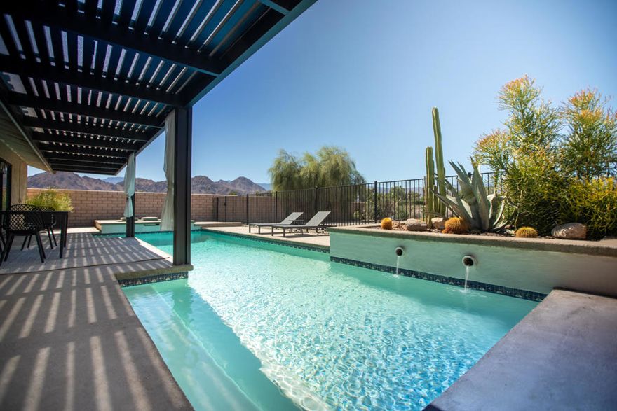 Imagine waking up to sweeping mountain views and ending your evenings poolside beneath starry desert skies. This private Palm Desert Country Club residence is a true retreat, offering a 40-foot saltwater lap pool with spa, panoramic golf course vistas, and a brand-new patio cover with integrated lighting--perfect for entertaining or simply relaxing in style. Inside, designer details set this home apart. A striking Venetian plaster fireplace anchors the living space, bedrooms include luxury herringbone carpet while modern smoked-glass fixtures and Lutron dimmers create an elevated ambiance throughout. The renovated bathrooms rival a luxury resort, featuring Carrara marble tile, brushed nickel fixtures, rain shower systems, and custom vanities. The chef's kitchen pairs stainless steel appliances with quartz countertops and a deep under-mount sink, blending form and function seamlessly. Smart-home enhancements--Google Nest thermostat, Remote pool/spa access via the Pentair mobile app and EV charging readiness--make life both elegant and effortless. Outdoors, a gated private courtyard with a personal putting green offers a playful touch, while drought-tolerant landscaping and automated sprinklers ensure beauty with ease. A two-car garage with built-in cabinets completes the home, providing practical convenience without compromising sophistication. Tucked at the end of a secluded street and just a short stroll from the Indian Wells Tennis Garden, this home combines privacy, luxury, and access to premier events like the BNP Paribas Open and the weekly Farmers Market. A rare opportunity to own not just a home, but a lifestyle.