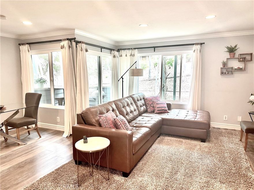 A beautifully upgraded and spacious 2 bedroom 2.5 bathrooms 2 story home located in the highly desired “The Woods” community in Lake Forest.  Enjoy the beautiful view from the kitchen and living area.   The main bedroom includes a walk-in closet, a full bathroom with a double sink vanity, shower in tub, vaulted ceiling, and a private deck with a gorgeous view.  The second bedroom also includes a private full bathroom.  Wood flooring, crown molding, and recessed lighting throughout.  Washer, dryer, and refrigerator are included.  1 carport plus 1 assigned parking space.  Membership to the Lake Forest Beach & Tennis Club is included.  A great place to call home!