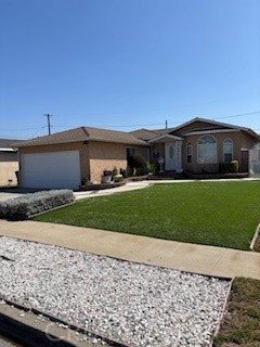 Welcome to this Compton gem!The spacious living room flows seamlessly into the dining area and kitchen, making it perfect for both everyday living and entertaining. The den and living room have warm recessed lighting.The kitchen is filled with stainless steel appliances. Enjoy three comfortable size bedrooms and an updated full bath, plus the convenience of an additional half bath. The roof was updated in 2021. Outside, the private backyard offers plenty of space to relax, garden, or host gatherings. The front yard is spacious with artificial grass and brick along the planter. Just minutes away great shopping and two magnificent colleges(Compton College,Cal St. Dominguez). Don't miss the chance to make this Compton beauty yours!