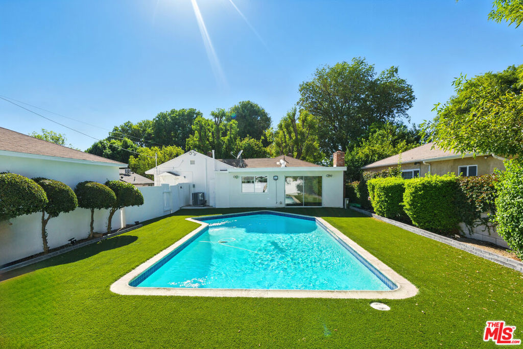Welcome to this beautifully updated 3-bedroom, 2-bathroom pool home in the heart of Reseda! Nestled on a quiet, tree-lined street, this residence perfectly blends comfort, style, and convenience.Step inside to a bright, open layout featuring new flooring, fresh paint, and an upgraded bathroom. The spacious living area is designed for both relaxing and entertaining, while the modernized kitchen showcases brand-new stainless steel appliances, quartz countertops, and white shaker cabinets, creating a clean and contemporary atmosphere.Enjoy the quintessential California lifestyle with private outdoor living. The sparkling pool is perfect for sunny days, while the enclosed patio provides versatile bonus spaceideal as a retreat, lounge, or home office. For added peace of mind, the property is fully gated, offering excellent privacy all around. Additional upgrades include central HVAC and dual-pane windows, ensuring year-round comfort and efficiency.Perfectly situated near local parks, shopping, dining, and schools, this move-in-ready home checks every box. Please note: the detached garage is not included with the lease, as it is being converted into a separate unit in the coming months.Don't miss your chance to call this Reseda gem your own schedule a showing today!