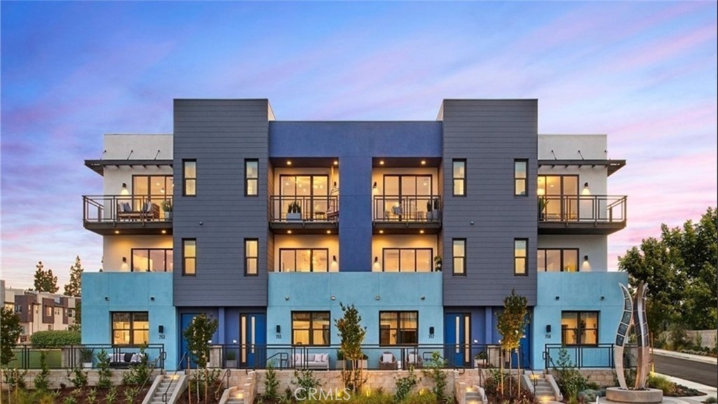 This former model town homes Located in the highly desirable West Village by Trumark Homes, offers 2,247 square feet of modern living space, including 3 bedrooms, 3.5 bathrooms, and a 2 attached garages. The first-floor bedroom with an en-suite bath is perfect for guests, in-laws, or a home office. The home features custom upgrades worth $199,000, including a gourmet kitchen with a large island and rare quartz countertops, and upgraded flooring throughout. The kitchen is designed for culinary enthusiasts, boasting high-end finishes and a spacious layout perfect for entertaining. The open floor plan creates a seamless flow between living spaces, enhancing the overall sense of space and comfort. This property also comes with fully paid solar panels, providing energy efficiency and cost savings. The HOA community offers a variety of amenities, including parks, play ground and a water park/tot lot. The location is incredibly convenient, with easy access to freeways, the Brea Mall, golf courses, and top-rated schools. Don't miss the chance to own this stunning condo with its modern design and premium upgrades.
