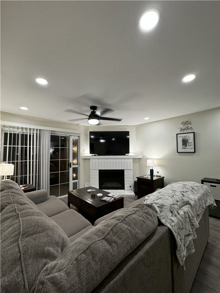 Welcome to this Main level Condominium in a Prime Location of Orangethorpe Village offering an open floor plan.  Location offers easy access, location privacy and pool view. The floor plan offers two huge bedrooms and two bathrooms. You won't believe the amount of space the bedrooms offer. Each of the bdrms are situated on the either side of the living room, dining area and kitchen. The living room has a gas burning fireplace and a sliding glass door leading out to the patio. The patio offers plenty of room for outdoor entertaining as well as storage. The Laundry area is conveniently located in a private room off the patio. This corner unit offers pleasing views of the association pool and jacuzzi.  Upgrades include new flooring, recessed lighting, new stove/double oven, full counter to cabinet backsplash in kitchen, dishwasher and microwave, fresh paint, new toilets, and 3 new top notch ceiling fans in both bedrooms and in the living room.  A/C and Heat upgraded in May 2022 and water heater was upgraded in 2023. Detached Garage unit with storage space.  Extra parking space can be purchased through the HOA. HOA pays for water, trash, pool, jacuzzi, exterior maintenance, and yard.  Come see this beautiful unit and make it yours!