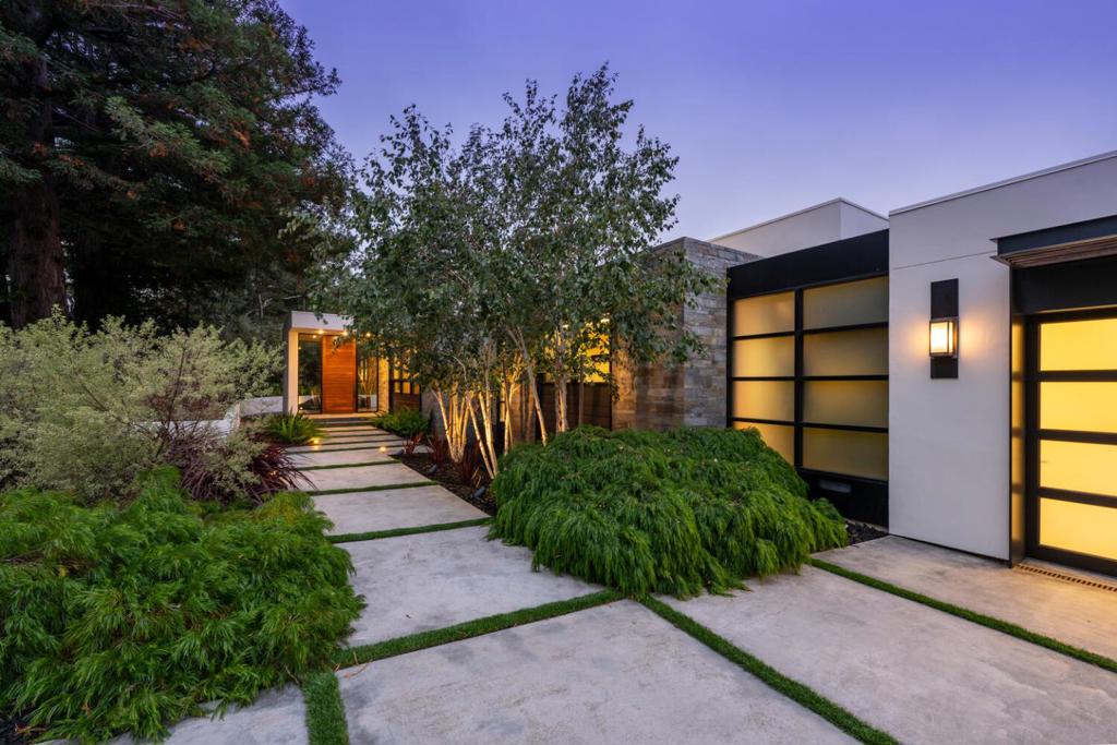 Luxury meets modern design in this stunning +/-4,485s.f. custom home by renowned Mak Studio Architects of San Francisco. Situated on a +/-0.50-acre lot with S.F. Bay views, this 4BR/3.5BA home was designed with impeccable attention to detail and is a sanctuary of modern elegance and tranquility. The open concept layout features soaring ceilings, rich hardwood floors, & dramatic floor-to-ceiling windows throughout. The living room with custom cabinets & sleek fireplace flows seamlessly to an expansive terrace covered by a motorized pergola and features a fire pit & outdoor kitchen - ideal for indoor/outdoor entertainment. The chic dining room with wall-to-wall windows showcases the lush scenery, while the chef's kitchen dazzles with top-tier appliances, island & butler's pantry, and opens to the expansive great room with amazing views. A private office with built-in desks offers the perfect work-from-home space. The lower level features 4 bedrooms, including a Zen-inspired primary suite with a wall of windows, fireplace, custom closets & spa-like bath. A large wine room & media room with rear yard access complete this level. The verdant, private grounds boast a huge level lawn, meandering pathways & multiple fruit & citrus trees. Truly a one-of-a-kind retreat in turnkey condition.