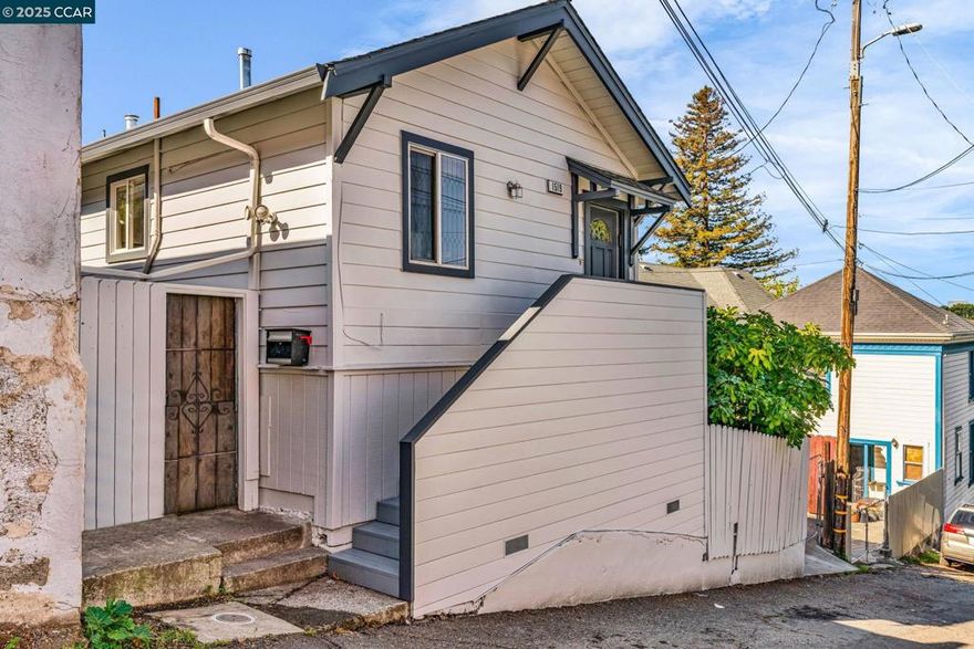 1519 Commerce Way — Cozy Living with Creative Possibility  This two-bedroom, one-bath home offers 560 square feet of inviting living space on an approximately 2,178 square foot lot. Built in 1921, it retains its classic character while offering the ease of move-in-ready living. The interiors feel bright and simple, with a refreshed kitchen and bath that honor the home’s original charm. In the backyard, a permitted detached office / art studio (approximately 220 sq ft) provides valuable flexibility — perfect for creative work, a quiet office, or a personal retreat. Located in Oakland’s San Antonio neighborhood, near San Antonio Park, Lake Merritt, and convenient commuter routes, this home delivers comfort, charm, and connection in one thoughtfully scaled package. Most recent upgrades include new exterior staircase, fresh exterior paint and open back yard