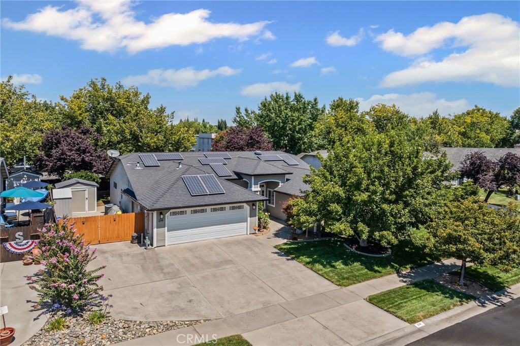 This home is a total gem—and it shows! Lovingly cared for by just one owner, it’s got that perfect mix of style, comfort, and “wow, they really thought of everything!” The kitchen is a dream, with seamless quartz counters that look like flowing art, shiny newer Samsung stainless appliances, and pull-outs in almost every cabinet. Say goodbye to the back-of-the-cupboard shuffle! There are handy built-ins in the living room and bedrooms that give you that neat and tidy vibe. The spacious primary suite boasts high ceilings with a walk-in closet providing seasonal storage for easy wardrobe transitions. Many of the big-ticket items are already handled. Newer HVAC, a 50-year comp roof with decades still to go, a 3-year-old owned solar power system, a smart thermostat and a security system, because this house is as clever as it is cozy. Let’s talk garage goals: epoxy floors that are ridiculously easy to clean, sleek built-in cabinets, and a utility sink for all your projects, big or small. The backyard is a little slice of paradise, with mature landscaping, a shady aluminum gazebo and an in-ground koi pond with a fountain—basically your own Zen retreat. And for bonus points you’ve got fenced RV parking with electrical hookups. Bring the adventure home! This place isn’t just move-in ready—it’s move-in-and-never-want-to-leave ready.