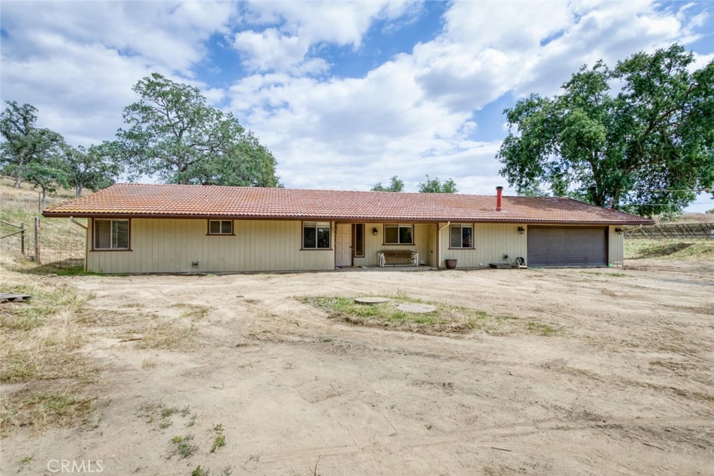 Escape to your private ranch oasis in Clovis! 4?bd,?2?ba ranch home on 5.14 acres with a tile roof & 46 solar panels. Paved all the way to the end of the driveway, with convenient curbside garbage collection. The open kitchen features a U-shaped counter with bar seating, flowing into two living areas—one with a pellet stove and one with a brick-accent fireplace. The primary suite includes dual sinks, built-in shelving, a private commode, and an oversized tile shower. Outside, enjoy fenced pastures for livestock, a hen house, and a cleared, level area at the back of the property that once served as a round pen for riding, ready for your fencing and horses. Some new luxury vinyl plank flooring has been added. Seller noted potential for an ADU or shop near the top of the lot, buyer to verify with county and HOA. Recent updates include the addition of a whole house fan and replaced dishwasher. Abundant wildlife, horse trails, and sweeping Table Mountain views complete the serene, rural setting, all within the Sierra Unified School District and near Millerton Lake.