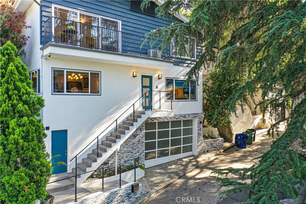Private Hollywood Hills Retreat with Stunning Views.
Nestled in the serene East Hollywood Hills, this beautifully designed 3-story, 3-bedroom, 4-bathroom residence offers a rare blend of privacy, comfort, and convenience. Tucked away on a quiet street surrounded by lush trees and tranquil canyon and mountain views, this home feels like your own private sanctuary—just moments from the best of Ventura Blvd, the Hollywood Bowl, and Universal Studios.
Boasting an open floor plan with hardwood flooring and recessed lighting throughout. The main living space is anchored by a cozy fireplace and opens to a lovely private enclosed backyard oasis. The kitchen features granite countertops, stainless steel appliances, and abundant natural light—perfect for both entertaining and everyday living.
Each bedroom offers ultimate privacy with its own en suite bathroom. Two bedrooms are located upstairs, including the spacious primary suite with a walk-in closet, luxurious bath with a jacuzzi tub, separate shower, and a dedicated makeup vanity. The third bedroom is located on the lower level with its own private entrance—ideal for guests, a home office, or rental potential.
Additional highlights include central HVAC, water filtration and softener systems, a two-car garage with EV charger, and proximity to top dining, shops, and entertainment. Renovations were completed in 2021 by the seller.
Whether you're seeking a peaceful escape or a stylish space in the heart of it all, this exceptional home offers the best of both worlds.