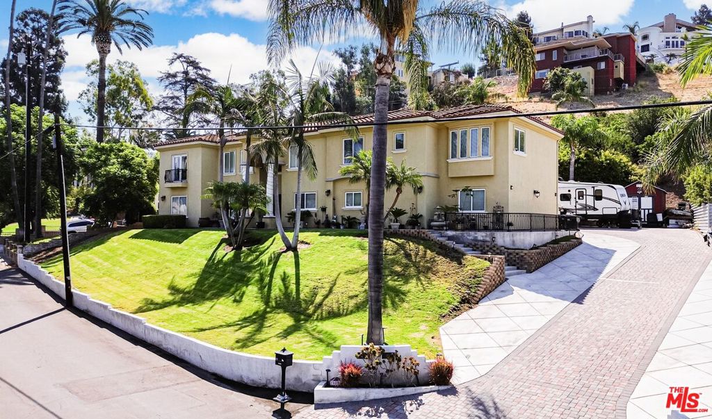 Beautifully Upgraded 5-Bedroom Home on Huge 23,100 Square Foot Lot in the Highly-Desirable Panorama Heights Neighborhood! Sitting on a bluff high above a quiet street, this 2-Story Stunner was recently remodeled & has been upgraded w/ the finest of finishes. Modern open-concept layout w/ hardwood flooring & lots of natural light throughout. Living room w/ exposed wood beam ceiling & full-length bi-fold patio doors for the ultimate indoor/outdoor living experience. Dining area w/ built-in cabinetry & custom stone fireplace. Chef's kitchen w/ white shaker cabinets, designer tile backsplash, quartz countertops, stainless-steel appliances, & center island/dine-in bar. Spacious Master Bedroom Retreat w/ fireplace, balcony w/ treetop views, huge walk-in closet, dual vanities, jetted spa w/ view, & standing shower. Generously-sized secondary bedrooms. All bathrooms throughout the home recently remodeled. Huge 2nd floor loft/game room area w/ built-in entertainment center, bar w/ kitchenette, & balcony overlooking the pool area (can be converted to a 6th bedroom suite). Backyard oasis that was made for entertaining: heated swimming pool/spa, covered outdoor Cabana area w/ fireplace, heat lamp, television, fireplace, & outdoor kitchen w/ BBQ, pizza oven, & fridge - your own personal backyard retreat! Matured landscaping throughout the grounds. Tesla solar system. 3 car garage. Huge driveway w/ RV access. Central AC + heat. Just minutes to local parks, award-winning schools, & the best shopping, dining, & entertainment the area has to offer. A truly turnkey home w/ all the bells & whistles - an opportunity that is not to be missed!