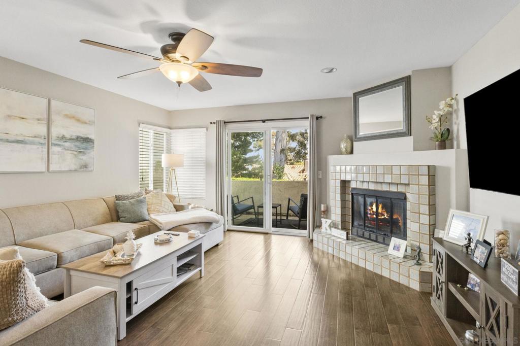 Enjoy the coastal breezes right from your private patio! Peaceful ground level, end-unit is designed to complement its natural surrounding, featuring dual pane windows that invite ample natural light and provide views of the outdoor scenery. Inside, the open-concept living space is perfect for entertaining, with modern amenities and rich finishes that blend comfort and style. Take advantage of the numerous amenities, including scenic picnic area, swimming pool, tennis court, sand volleyball court, exercise room, clubhouse and shaded seating area perfect for reading and relaxing. West of the I-5. A short distance to Mission Bay, Mission Beach, Sea World, Fiesta Island, parks, restaurants/bars and much more!