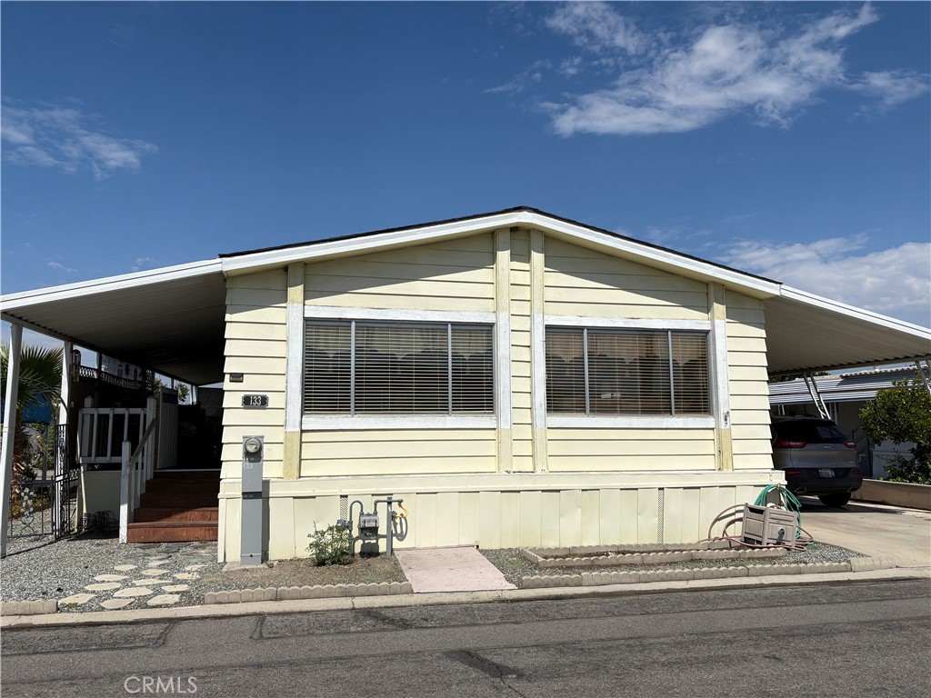 55+ Senior community. Really a cutie inside! Large open great room with a formal dining area. Large windows for lots of sunlight, easterly facing for the morning sun. Remodeled and upgraded kitchen featuring stainless steel refrigerator, DW, microwave, cabinets with newer doors and a moveable island that's included. Large master bedroom and ample sized 2nd bedroom. Bathrooms have also been remodeled. Newer cabinets, toilets and attractive soft pine lap siding on the walls of the guest bath. Updated lighting and ceiling fans throughout. There is a shaded and vinyl fenced area for human and furry friend life. Drywalled throughout. The park is centrally located so you can walk to shopping, restaurants, park and transportation if needed. Security fencing all around the community. Clubhouse with pool/spa/kitchen and social area. The park has a clean, well maintained look. Application for the park is attached in supplements.