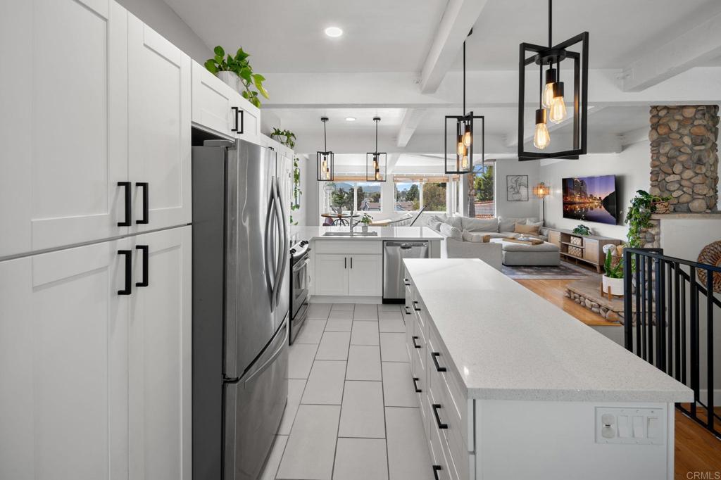 Step inside and immediately feel at home as natural light floods the living space, framing breathtaking views of La Costa and the golf course. This end-unit townhome is loaded with upgrades, blending modern style with everyday comfort in one of Carlsbad’s most desirable communities. The open living area showcases soaring windows, a striking custom stair railing, and seamless indoor-outdoor flow, making the most of the incredible views. The updated kitchen, refreshed flooring, and a stunning remodeled master bathroom add a touch of luxury throughout the home. Upgrades include paid-off solar, an updated electric panel, EV charger, and a new water heater, delivering convenience, efficiency, and peace of mind. A private two-car garage provides storage and functionality. All of this is set within a top-rated school district and just minutes from shopping, dining, and the coast—making this home the perfect combination of lifestyle and location.