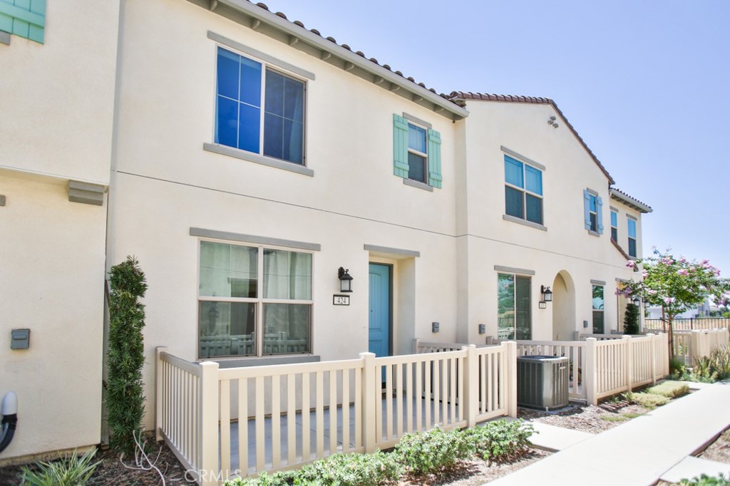 Welcome to a beautifully updated 3 bedroom, 2.5 bath home located in a quiet, gated community in Rialto. This move-in ready property offers a bright and open floor plan with modern finishes throughout, perfect for both entertaining and everyday living. The spacious living area flows seamlessly into a contemporary kitchen, creating an inviting space for family and friends. One of the standout features of this home is the energy-efficient solar panel system, offering both environmental benefits and significant savings on your utility bills. Additional conveniences include central heating and air conditioning, laundry hookups, and access to community amenities such as a sparkling swimming pool and a children’s playground, all included with the HOA. Located near schools, shopping, and major freeways, this home provides the ideal balance of comfort, style, and convenience. Don’t miss the opportunity to own a modern home with smart upgrades in one of Rialto’s most desirable neighborhoods!