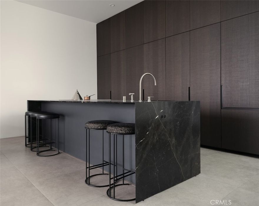 Welcome to Asteras Kings, a collection of 25 carefully designed hyper-luxury Residences. The building is characterized by clean, modernist lines, and a distinguished playfulness in form. By taking cues from the pedestrian pathways of nearby Melrose Place, the building architecture reveals light atriums, courtyards and passageways, providing discrete entrances and a brilliance to each Residence. The Residences have expansive terraces and courtyards that blur the distinction between indoors and outdoors. Residence 103 is a spacious one-bedroom plus office residence showcasing high-end imported natural finishes, a hyper-luxury minimalist design, and 2,013 square feet of combined interior and exterior usable living space, including three private terraces. Featuring honed large-format tiles, narrow-plank solid oak hardwood flooring, a waterfall edged marble countertop kitchen, Miele appliances throughout, marble floating vanities and stainless-steel slender fixtures in its bathrooms. The expansive dressing room features matte lacquer doors with fumed glass and metal detailing. Amenities include a 24-hour concierge, heated spa pool and sundeck lounge with cafe bar, private screening room, fitness studio, pet wash, optional valet parking, gated garage with car detailing and a menu of a la carte services provided by staff. Curated to serve and designed to relax or entertain, the focus at Asteras Kings is simplicity without compromise.