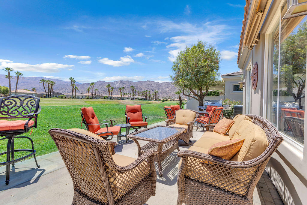 Welcome to your desert retreat in the highly desirable community of Duna La Quinta! This spacious 2BD+Den/Office, 2BA home spans approx. 1,830 sq ft and offers a flexible floor plan--currently configured with a dining room but easily adaptable as an office, den, media room, or guest area.Located on the 4th Green of the Pete Dye Dunes Course, the home boasts breathtaking, unobstructed southwest views of the Santa Rosa Mountains--a stunning backdrop for enjoying sunsets, mountain silhouettes, and golfers passing by. Whether you're sipping morning coffee or hosting guests on the expansive patio, the automated awning and fire table add both comfort and charm year-round.Inside, you'll find newer stainless steel kitchen appliances, updated carpet and a thoughtfully maintained interior. The layout provides seamless flow from living areas to the outdoors, taking full advantage of the panoramic golf course and mountain views.Residents enjoy access to three sparkling pools--with one just about 100 yards away, often quiet and peaceful. You'll also have shared pickleball court access, making it easy to stay active and social. The HOA takes care of landscaping, exterior maintenance, cable TV, and WiFi, offering a truly low-maintenance lifestyle. The exterior of the home was freshly painted in February 2025, ensuring great curb appeal and long-term upkeep.One of the community's greatest perks is its location--you can golf cart into Old Town La Quinta or to the iconic La Quinta Resort, enjoying dining, shopping, and entertainment just minutes from your door.Whether you're looking for a full-time residence, a seasonal getaway, or a great investment property, this home delivers on lifestyle, luxury, and location. Come experience what makes Duna La Quinta living truly special.This stunning home is offered fully furnished, complete with a golf cart for your convenience and enjoyment!