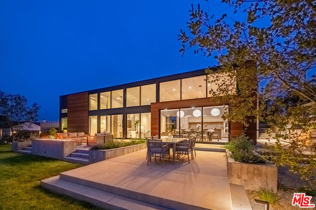 Just completed construction looking for its first owner! This single-story home with sweeping canyon views embodies both an innovative style with luxury finishes along with the casual comfort of Malibu. Located at the end of a quiet cul-de-sac on an exclusive street of Point Dume, this home also offers amazing proximity to conveniences such as shopping and restaurants as well as the highly regarded Point Dume Elementary School. This spectacular gated home features a 3bd/3ba floor plan (plus office and bonus room), and was designed by emerging local architect, Ryan Brown. The living space offers an abundance of light with vaulted wood ceilings, several large sliding glass doors that open to the backyard, and gorgeous white oak flooring throughout. These spaces are further enhanced by lime wash painted walls in the common areas and beautiful Tadelakt plaster in the primary and secondary bathrooms. Entering this home, you are struck by the views as you step down into a family room that is anchored by a fireplace surrounded by gorgeous stone. The adjacent spacious kitchen opens to the dining area and also captures the picturesque views of the property. The kitchen features include abundant rift oak cabinetry, premium Wolf appliances, and unique niceties such as built-in refrigerated drawers and wine storage. All three bedrooms also enjoy the benefits of the vaulted wood ceilings and incredible light. Additionally, the stunning primary bedroom features a luxurious bathroom with a separate soaking tub and large shower, and a see-to-believe walk-in closet. There is also an adjacent room with a view that could make an ideal office or workout space. The two secondary bedrooms include beautiful built-out closets with rift oak doors, and a shared bathroom with two sinks, ample stone counter space, and a striking walk-in shower. The nature of the floor plan and access to the backyard make this an ideal home for entertaining and enjoying the outdoor living spaces which include areas for dining, lounging and gathering around a custom fireplace. There is also a built-in BBQ cooking area with a pass-through window from the kitchen, a large lawn for play, and a separate wood deck and cedar hot tub for relaxing and enjoying the canyon views. This home offers indoor/outdoor living at its finest!This unique home also offers roof-top solar energy panels and storage batteries to maximize energy efficiency. Additionally, charging access for an electric vehicle and/or a golf cart are discretely built into the infrastructure of this home. The home's systems also include a Ring camera, a smart Frame TV, speakers (indoor and outdoor) to accommodate music in the common areas, and wiring for potential security cameras. This home offers the best of Malibu living and is a must see property with its desirable location relative to dining, shopping, great schools, and Malibu's finest beaches. There is no better place to call home than Point Dume!
