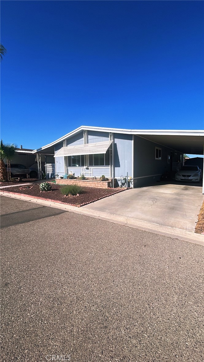 Welcome to this beautifully maintained 2-bedroom, 2-bathromm home offering 1,33 sq.ft. of living space in a desirable mobile home community. Step inside to find an open and inviting floor plan with plenty of natural light & spacious bedrooms. The home has been thoughtfully updated with wood floors throughout, with a recently updated & painted kitchen, featuring a gas stovetop. Climate-controlled windows, and a brand-new A/C system with updated parts within the past 2 years.
Accessibility is a priority with a handicap access ramp and showers large enough to accommodate. Additional highlights include a large laundry area, a functional shed with electricity, and an 8x16 addition complete with its own a/c for year-round comfort.
This vibrant community provides resort-style amenities including two sparkling pools, a relaxing spa, tennis and basketball courts, a fitness center, and 24-hour security- everything you need for comfort, recreation, and peace of mind.
Whether you're looking to relax, stay active, or connect with neighbors, this home and community have it all.
Conveniently located near shopping, dining, and major freeways, making daily living a breeze!