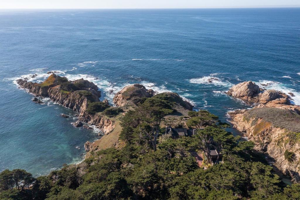 Spindrift, the most iconic oceanfront estate in the Carmel Highlands, is on the market for the first time in nearly fifty years. Seven flat, awe-inspiring acres serve as the backdrop of this 4,300 square foot English manor house designed by Charles Gottschalk and Charles Sumner Greene, which includes six bedrooms, six bathrooms, and various outbuildings. The gated granite entrance welcomes you with a cypress tree-lined driveway. Surrounded by three sides of the Pacific Ocean and protected by stunning cypress groves, the coastal views and privacy are unparalleled. Private hiking trails on two ocean bluffs conclude at the water's edge with access to tidepools and a secluded cove. If you are looking for a once-in-a-generation oceanfront estate, you have found it.