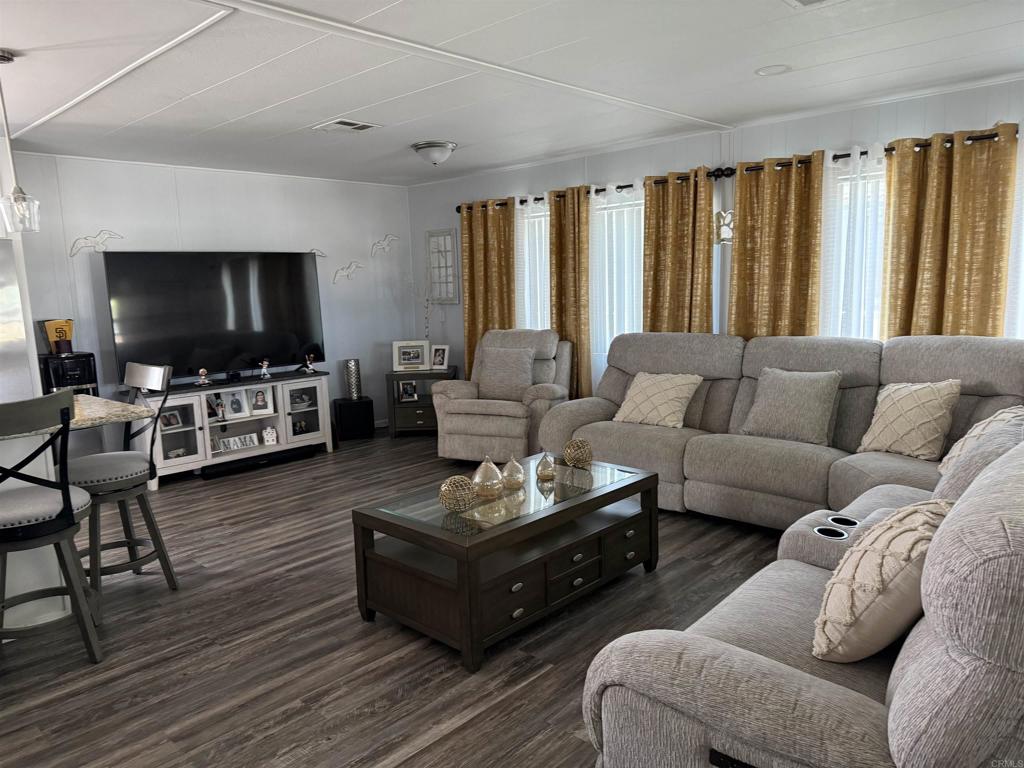 Welcome to the Ocean Bluff's fabulous 55+ park!, This home is setting at the end of a cul-de-sac, it was remodeled inside and out, with new vinyl plank flooring, granite countertops, new fixtures, new cabinets. The mobilehome has 2 bedrooms, 2 baths, an extra room, a large attached shed and a backyard that opens to a scenic view of beautiful green yards, trails . The master suite offers a walk-in closet and additional storage space. A peaceful setting of the back patio on the greenbelt, perfect place to enjoy your morning coffee along with nice cool breeze. The ideal location and large open floorplan offer the comfort of modern living.