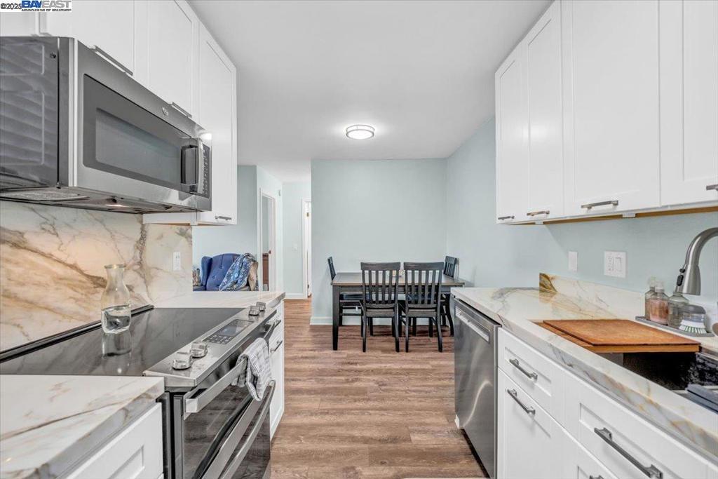 Experience modern coastal living in this beautifully remodeled condo, ideally located just minutes from Del Monte Shopping Center, downtown Monterey, the movie theater, and with convenient access to Carmel and Pebble Beach. This move-in ready home has been thoughtfully updated with contemporary finishes and timeless elegance. The stunning kitchen features marble countertops, custom cabinetry, a marble backsplash, soft close drawers and brand new appliances—perfect for both daily living and entertaining. Rich flooring flows throughout, complemented by a beautiful bathroom and a dedicated office space ideal for remote work or quiet retreat. Fresh paint throughout also. Step outside to your private deck and enjoy serene views among mature oak trees—an ideal setting for morning coffee or evening relaxation. Set within a well-maintained community, residents enjoy access to a heated pool, BBQ area, clubhouse, covered parking, and convenient laundry facilities.