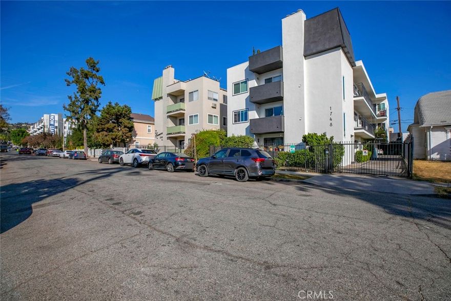 Welcome to this stylish 2-bed, 2-bath condo, perfectly situated just below the Hollywood foothills. The bright open living and dining area is filled with natural light and extends to a private balcony with city views. The kitchen features rich wood cabinetry, black countertops, stainless steel appliances, and plenty of storage. Both bedrooms are spacious with ample closets, and the bathrooms showcase tasteful tilework and timeless finishes.



This end unit offers extra privacy with no neighbors below, plus two parking spaces, storage, low HOA fees, and gated entry. Located minutes from shopping, dining, and entertainment, it’s an ideal choice for a chic city home or investment.

*Several photos are virtually staged*