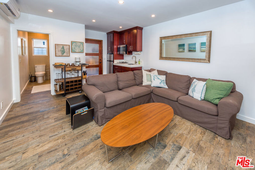 Live the ultimate beachside lifestyle! This rare opportunity places you just steps from the sand in an updated one-bedroom, one-bathroom unit. Nestled in the vibrant heart of Venice, enjoy effortless access to the shops, cafes, and restaurants on Abbott Kinney, Main Street, Gold's Gym and the iconic Boardwalk. The open-concept floor plan features a sleek kitchenette with stainless steel refrigerator, microwave, and cooktop. The beautifully updated bathroom boasts custom tilework and a glass-enclosed shower with a luxurious rain shower head. Private asher and dryer located in the garage with one parking space.