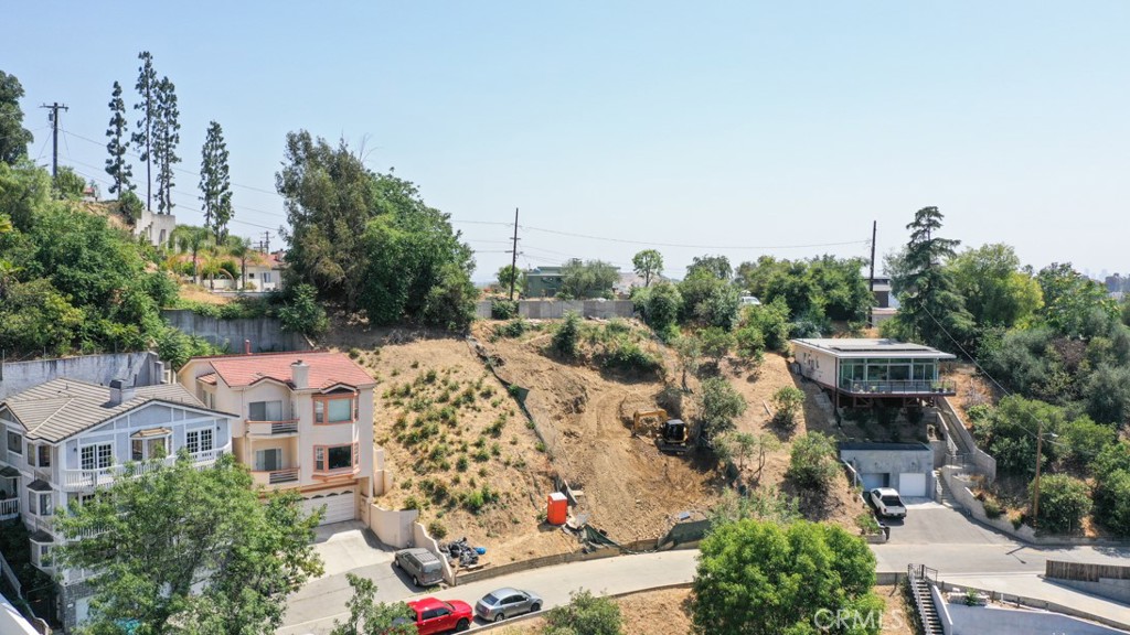 Nestled in the hills of South Pasadena, 2131 Hanscom Dr offers a rare opportunity to build your dream home with breathtaking panoramic views. Located in one of the most sought-after neighborhoods, this vacant lot is one of the few remaining with incredible potential and scenery. Enjoy top-rated South Pasadena schools and easy access to nearby hotspots including Old Town Pasadena, Highland Park, DTLA, and the 110 freeway. Surrounded by custom homes and mature trees, this peaceful hillside location blends privacy with convenience. Don’t miss your chance to create a one-of-a-kind home in a prime location!