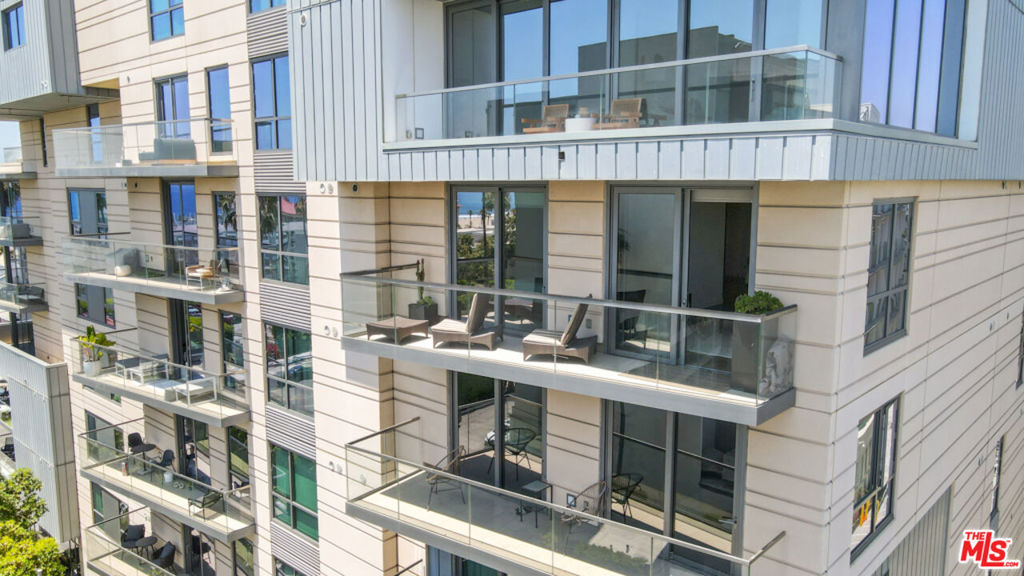 Experience the pinnacle of coastal luxury in this exquisite south-west facing 2-bedroom, 2-bathroom corner residence at The Seychelle, Santa Monica's premier full-service building. Spanning 1,400 square feet, this meticulously designed home by Clodagh Design International boasts an open-concept layout with clean lines and abundant natural light. Enjoy breathtaking ocean views from the spacious balcony, accessible from both the living area and the primary suite. The gourmet kitchen is equipped with top-of-the-line Thermador appliances and quartzite countertops, perfect for culinary enthusiasts. The primary suite offers a serene retreat with a luxurious bathroom featuring dual sinks, a separate soaking tub, and an indulgent rainfall shower. All 5 closets have been upgraded with California Closets systems. A split floorplan ensures privacy, placing the second bedroom on the opposite side of the unit. Private storage cage is included along with 2 side by side assigned parking spaces in the secured garage. Residents of The Seychelle enjoy unparalleled amenities, including a 24-hour concierge and doorman, rooftop pool/spa and lounge with panoramic views, BBQ area, state-of-the-art fitness center, yoga studio, business center, a pet spa, guest parking and electric car chargers. Located steps from the beach, world-class dining, and shopping, this residence offers the ultimate in coastal living. Seller extends $25,000 credit to buyer for closing costs.