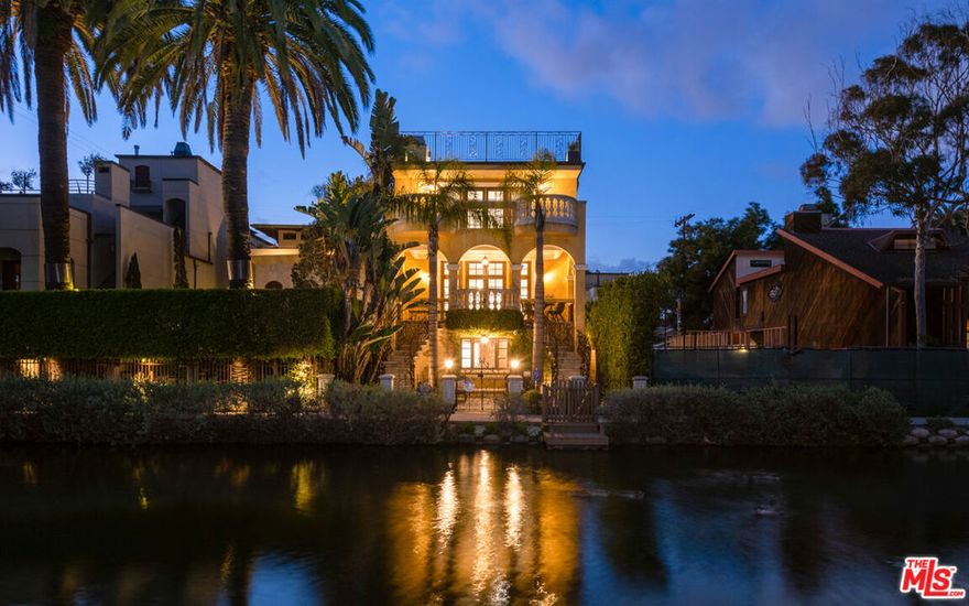 Elegantly nestled along the iconic Venice Canals of Los Angeles, this rare lease opportunity offers a truly unique and beautifully furnished 4 bedroom, 3.5 bathroom home expertly remodeled and thoughtfully designed with luxury in mind. Step into a grand, light filled living space featuring an open layout and an expansive balcony that frames tranquil canal views. The chef's kitchen is outfitted with sleek built-in stainless steel appliances and offers generous space, perfect for hosting unforgettable dinner parties. Designed by an Italian architect with an emphasis on seamless indoor/outdoor flow, this home is bathed in natural light and exudes sophisticated coastal charm. The resort-style primary suite boasts its own private balcony, ideal for soaking in breathtaking views. Three oversized guest rooms offer peaceful retreats for family or visitors. On the ground floor, enjoy your own private theater, perfect for movie nights and laid back entertaining. Outside, a beautifully appointed living area invites you to relax under the sun or stars, all just blocks from the ocean and minutes from the lively Venice Boardwalk. To top it all off, the expansive rooftop terrace provides a stunning setting for entertaining or unwinding, with sweeping views of the canals, sunsets, and the city skyline. Located close to the Venice boardwalk and Abbot Kinney restaurants and shops. This is Venice Beach living at its finest, a true gem and the ultimate staycation destination.