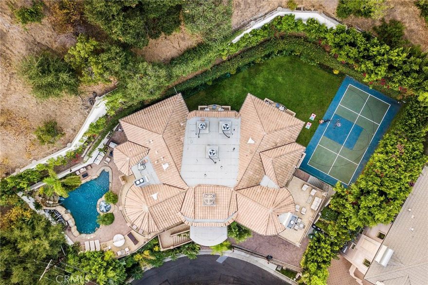 Gated and private Mediterranean estate is offered for immediate lease, fully furnished.   Tucked away on a quiet alcove just minutes from the Beverly Hills Hotel, Franklin Canyon Reservoir, Rodeo Dr. and Sunset Blvd. walk to Coldwater Canyon park. Estate offers the ultimate blend of privacy, luxury, and resort-style living.

Spanning approx. 7,500 sq. ft. across 3 levels, the home features 7 en-suite bedrooms and 7.5 baths, each with private patios or balconies that welcome natural light and garden views. The grand primary suite includes dual oversized closets, a spa-like bath with soaking tub overlooking the grounds. 

Designed for both entertaining and relaxation, the estate boasts a sports court, dry sauna, pool with spa and waterfall, outdoor kitchen, billiards room, home theater, and bar. The chef’s kitchen and large dining area is complemented by a dedicated wine/buffet service room/and bar, ideal for gatherings. Additional highlights include a 3-car garage, gated motor court, and lush landscaped grounds, walled and private back yard. Property is available for both short- and long-term lease, 1 year leases or greater are preferred.  List price reflects long-term leases; utilities may be included with short-term leasing.