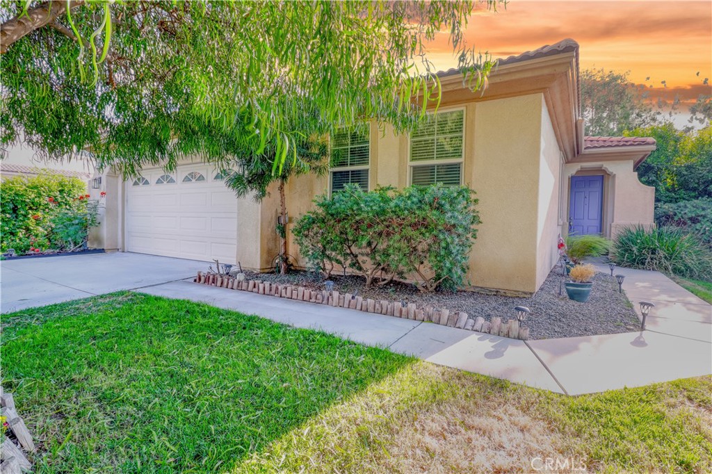 Located in East Hemet and on a peaceful cul-de-sac, this home is Move-in ready, Spacious, and RV-ready!
It has been well-maintained with 3-bedrooms and 2-bathrooms. This home checks all the boxes: gated RV parking, great-sized lot, and thoughtful upgrades throughout.
Step into a bright and welcoming open floor plan featuring new wood-style flooring in the living and dining areas. The living room includes a cozy gas fireplace, and the dining area flows seamlessly into a spacious kitchen with recessed lighting, ample cabinetry, a breakfast bar, and casual dining space near a second slider to the backyard.
The primary suite offers direct patio access, a large walk-in closet, dual sinks, and a built-in vanity. Outside, the backyard is perfect for relaxing or entertaining, complete with a moderate covered patio space, green lawn, trees, two storage sheds, and block wall fencing for privacy.
Enjoy the convenience of a fully drywalled garage, low taxes, no HOA, and a location just minutes from schools, shopping, and restaurants.