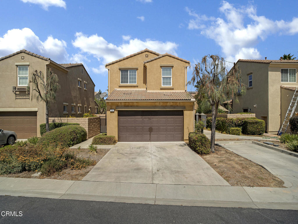 Move-in ready 4-bedroom, 3-bath home in Greenbriar neighborhood of Simi Valley. The main level features an open-concept living area with wood-style flooring and recessed lighting, along with a convenient downstairs bedroom. The kitchen offers granite countertops, Euro-style cabinetry, center island, and stainless steel appliances, opening directly to the family room and dining area.Upstairs, the primary suite includes a large bath with dual vanities, soaking tub, and separate shower. Additional bedrooms are light-filled with clean, modern finishes.Enjoy a private outdoor patio, perfect for entertaining, plus a 2-car attached garage. Built-in refrigerator, washer, and dryer are included!