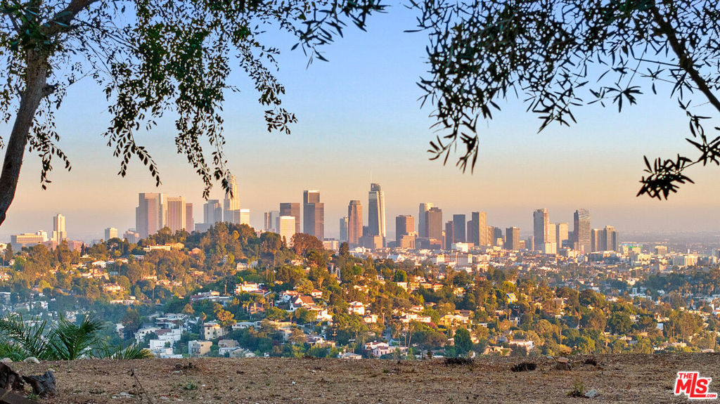 Available for the first time in 70 years. An opportunity to acquire the rarest of the rare: a street to street lot on one of Los Feliz' highest view roads. Elevated above both streets sits an enormous all-flat pad on a lot over 30,000 sqft in size. The north side offers weeping views of the San Gabriel and Verdugo mountains to the north, visible from every portion of the home. To the south, a nearly 130 foot wide overlook of LA takes in views far east of downtown, spanning west out to Palos Verdes, Catalina, the beach cities and beyond. Bring new life back to the current home that currently stands or create something entirely new and spectacular with a site of this scale. Plans (non RTI) are available from AKDA architecture for a stunning modern that takes advantage of this site's incredible qualities. A rare opportunity that won't last, and may never come again.