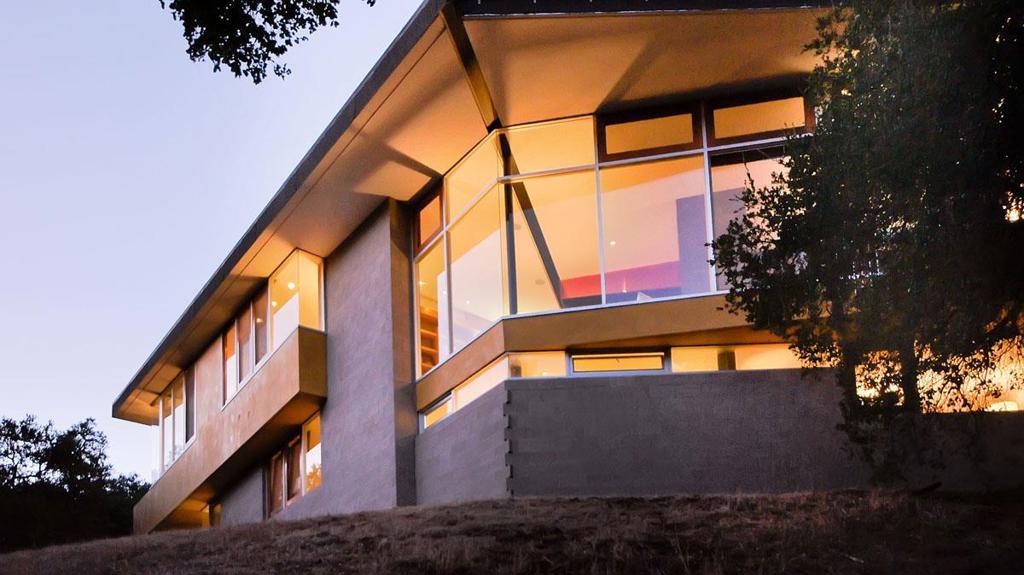 This modern living sculpture is a testament to the organic architectural philosophies of Frank Israel and Frank Lloyd Wright. Here, Callas-Shortridge Architects formed an evolving dialogue between the land and the built form, a harmonious convergence of artistry and nature. Forged from a robust steel, the design emphasizes the beauty of natural materials, allowing them to flow seamlessly and create a tranquil environment. Terrazzo and hardwood floors and natural light cascading through walls of windows enhance this sense of serenity. Architectural block construction and minimal drywall, punctuated by copper accents and furniture-quality millwork and cabinetry, speak to a commitment to quality and timeless design. A dedicated artist's retreat connects to the principal residence via soaring covered walkway and is a haven for creative exploration. A heated pool and pool house offer contemplation and rejuvenation. 700-amp power supply, solar panels, integrating modern amenities with sustainable practices: the stainless steel kitchen, ipe wood decks, outdoor kitchen, two-car garage and a 3-car carport. Over $9,000,000 was invested. This is more than a home it is an experience, a curated environment designed to inspire and nurture the creative mind, body, and spirit. 5 minutes to 280.