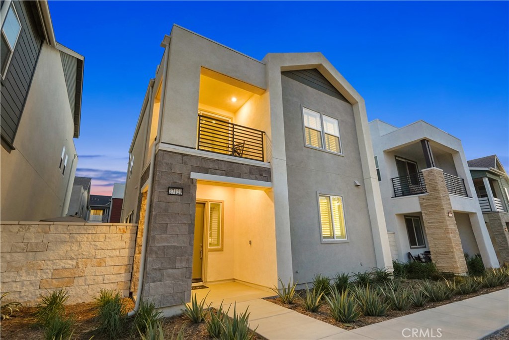 This gorgeous detached residence is perfectly situated in the highly sought-after Five Point community in the front row of homes. With beautiful views, this home offers the epitome of modern living, featuring soaring ceilings, luxurious high-end finishes & a prime location with breathtaking city light &
Mountain views and an array of top-notch incredible amenities just steps away. Step inside, and you'll immediately appreciate the well-designed
layout. The main level boasts a spacious & brilliantly lit great room, a convenient powder room, and direct garage access. The kitchen, a masterpiece of modern design, showcases gleaming quartz countertops, pristine white shaker cabinets, a stylish designer backsplash, an oversized
island with a breakfast bar & top-of-the-line GE Cafe appliances. Upstairs, you'll discover three generously sized bedrooms, including a stunning
primary suite, all w/ soaring 11 foot high ceilings. This primary retreat is a sanctuary of luxury, featuring dual vanities, upgraded tile work, Lg.
walk-in closet & private patio to soak in the stunning views. Two additional bedrooms share an upgraded full bathroom. The convenience of an
upstairs laundry room and ample storage space, enhances the modern living experience. This home is loaded with premium features, including
plantation shutters, high-end hardwood flooring on the main level, designer carpeting and ceiling fans. The 2-car attached garage offers additional
space for golf cart parking. There is overhead storage, an EV charger, storage cabinets with a workbench and a pegboard in the garage closet. A
private yard awaits your gatherings, complete with custom pavers & low-maintenance artificial grass. But that's not all – property has solar, smart
technology, the community has been thoughtfully designed as a net-zero oasis. If a genuine sense of community is what you seek, you've found
your perfect haven. Confluence Park, located right across from your doorstep, boasts 3 resort-style pools, a community garden, an adventurous
playground, BBQ grills and a sprawling fire pit for memorable moments. Regular community events and gatherings ensure there's something for
everyone. With 24/7 private security, proximity to Magic Mountain, and seven planned schools, this is more than just a home; it's a vibrant lifestyle
waiting for you to embrace!