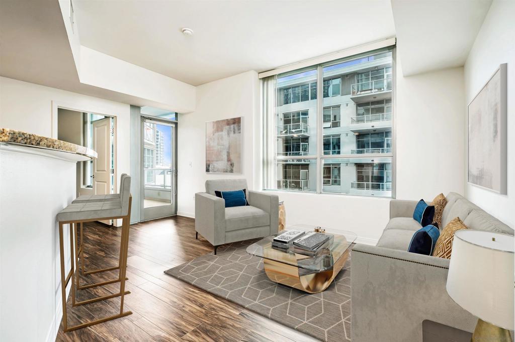 Experience the ultimate in downtown San Diego living with this beautifully upgraded 2-bedroom, 2-bathroom residence located in the heart of East Village—just steps from Petco Park, the Gaslamp Quarter, and the city’s best dining, nightlife, and entertainment. This stylish condo offers an open-concept layout with plank flooring, large windows, and a private, oversized terrace—your own serene retreat amid the city buzz. The kitchen is sleek and functional, featuring stainless steel appliances, granite countertops, and modern cabinetry, ideal for both everyday living and entertaining guests. The building offers the best of both convenience and security, with controlled access, and amenities like a large courtyard BBQ area, social lounge and fitness center. Included with the unit are two side-by-side parking spots. Live a highly walkable lifestyle with restaurants, cafés, the Central Library, Padres games, waterfront, parks and trolley access all within blocks. Whether you’re commuting, catching a concert, or grabbing coffee with friends, everything you need is just outside your door. Don’t miss this rare opportunity to own a downtown residence that truly captures the energy, convenience, and vibrancy of San Diego living.