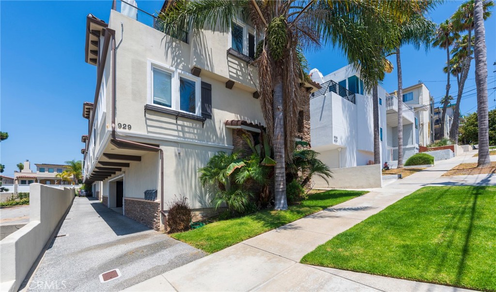 LUXURIOUS-CONTEMPORARY TOWNHOUSE W/ AMAZING PANORAMIC OCEAN VIEWS, HIGH-END AMENITIES & 2-CAR GARAGE CLOSE TO SHOPPING & 6 BLOCKS TO BEACH. ZONED FOR TOP SCHOOL DISTRICT (Pre K – 12). Luxury Townhouse with Panoramic Ocean Views – Available August 2025. This 3 bedroom, 2.5 bathroom home offers approx. 1,900 sq. ft. of living space plus an additional 300 sq. ft. ocean-view patio. Includes a two-car garage with ample storage, guest carport and plentiful street parking. The upper-level great room features a skylight, creating a bright and airy living space, while the living room includes a fireplace and French doors that open to a balcony with unobstructed views stretching from the Palos Verdes peninsula to Malibu. The modern open-concept kitchen boasts quartz countertops and high-end Jenn Air stainless steel appliances including a five-burner gas stove, with an adjacent dining area perfect for entertaining. All bedrooms are on the same floor; the primary suite features ocean views, a walk-in closet, and a luxurious bath with Kohler fixtures and a hydro-jet tub. Secondary bedrooms have mirrored closets with built-in organizers, and the second bedroom also offers ocean views. Wide-plank hardwood floors highlight common areas, with carpet in bedrooms and tile in bathrooms. A laundry closet on the second floor includes full-sized LG washer and gas dryer, and a tankless water heater adds efficiency. Technology and extras include two wall-mounted 42" flat-screen TVs in guest rooms, wiring for surround sound, satellite/cable and ADT, plus intercom and camera readiness. Well-maintained common grounds feature attractive landscaping. Ideally located just six blocks from the beach (less than an eight-minute walk) and about three miles from the 405 freeway, this home is also zoned for highly rated schools (Pre-K through 12) and is a short drive to shopping and dining. Small pets may be considered with an additional price premium to rent. This townhouse offers modern amenities, stunning ocean vistas, and convenient access to both the beach and major freeways—it’s a must-see to fully appreciate the quality and comfort it provides. $300 monthly premium to be added to the listing price if the owner approves a small dog pet application.