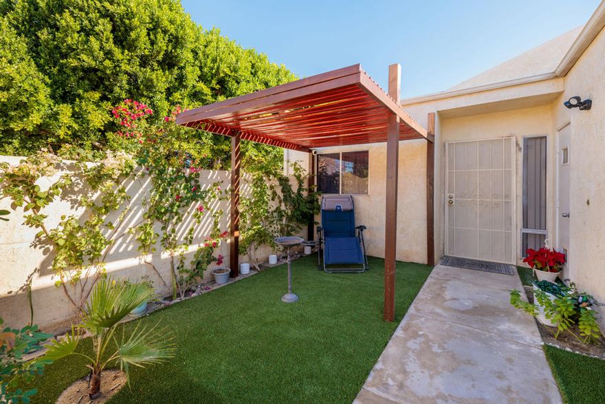 Welcome to this beautifully situated end-unit condo in the heart of Bermuda Dunes, offering the privacy and comfort of a single-family residence. This spacious two-bedroom, two-bath home features a rare private courtyard--perfect for relaxing, entertaining, or enjoying peaceful desert mornings--along with an additional rear patio that extends your outdoor living space.Inside, the living area is filled with abundant natural light from multiple picture windows and is highlighted by a cozy fireplace, creating a warm and inviting atmosphere. The end-unit location enhances privacy and light, while a newer A/C provides year-round comfort. An attached two-car garage adds everyday convenience and storage.Enjoy resort-style living with the community pool located just steps from the unit. Centrally located near freeways, grocery stores, restaurants, banks, and shopping, this home offers both lifestyle and accessibility. A rare opportunity that truly lives like a standalone home--don't miss this Bermuda Dunes gem.