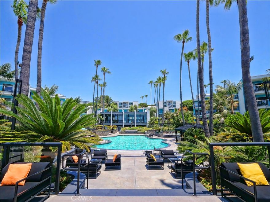 FLEXIBLE LEASE TERM AND FLEXIBLE UNFURNISHED OR FULLY FURNISHED. Oceanfront living and ocean views are highlighted in this Redondo Beach condo. The living/dining area and the bedroom have access through large sliding glass doors to a tiled balcony overlooking a the ocean and Redondo Beach Pier. Floor-to-ceiling mirrors opposite the sliding glass doors reflect ocean views throughout the living space.  The remodeled kitchen has quartz countertops, and upgraded appliances. Furnishings include all linens, tableware, and cookware. There are two assigned parking places. Multiple EV charging stations are available in the gated visitor parking area. EV parking to come in assigned parking spaces. There is a full-time on-site manager. This condo has great views of sunsets, and in summer the colorful sails of sailboats returning to the harbor is a special treat. This complex is unique in that residents have access to two beautiful pools surrounded by beautiful landscaping and palm trees. The smaller ocean-view pool’s turquoise water has a stone deck along with stacked stone retaining walls. This pool area also includes a hot tub, pool furniture, stainless steel barbecues, and a fire pit. The large pool’s stunning landscaping and amenities provide a vacation-like feel. Upgraded furniture, cabanas, a large hot tub, barbecues, and fire pits overlook the pool, the ocean, harbor, and the bike path. There is a gym near the pool with views of the pool, palm trees, and ocean. A great small restaurant is also next to this pool. Nearby: Direct access to the Pier is also available from the condo complex and adjacent to the Santa Monica bike path. Other attractions just outside the gated complex include a weekly Farmer’s Market, waterfront restaurants, paddle boat, kayak, whale watching tours and bike rentals — and of course, the beach! Nearby are the Hollywood Riviera Village, Hermosa Beach, and Manhattan Beach. LAX is seven miles away and Downtown LA is 20 miles away. No Pets.