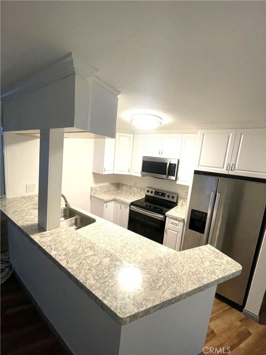 FLEXIBLE LEASE TERM AND FLEXIBLE UNFURNISHED OR FULLY FURNISHED. Oceanfront living and ocean views are highlighted in this Redondo Beach condo. The living/dining area and the bedroom have access through large sliding glass doors to a tiled balcony overlooking a the ocean and Redondo Beach Pier. Floor-to-ceiling mirrors opposite the sliding glass doors reflect ocean views throughout the living space.  The remodeled kitchen has quartz countertops, and upgraded appliances. Furnishings include all linens, tableware, and cookware. There are two assigned parking places. Multiple EV charging stations are available in the gated visitor parking area. EV parking to come in assigned parking spaces. There is a full-time on-site manager. This condo has great views of sunsets, and in summer the colorful sails of sailboats returning to the harbor is a special treat. This complex is unique in that residents have access to two beautiful pools surrounded by beautiful landscaping and palm trees. The smaller ocean-view pool’s turquoise water has a stone deck along with stacked stone retaining walls. This pool area also includes a hot tub, pool furniture, stainless steel barbecues, and a fire pit. The large pool’s stunning landscaping and amenities provide a vacation-like feel. Upgraded furniture, cabanas, a large hot tub, barbecues, and fire pits overlook the pool, the ocean, harbor, and the bike path. There is a gym near the pool with views of the pool, palm trees, and ocean. A great small restaurant is also next to this pool. Nearby: Direct access to the Pier is also available from the condo complex and adjacent to the Santa Monica bike path. Other attractions just outside the gated complex include a weekly Farmer’s Market, waterfront restaurants, paddle boat, kayak, whale watching tours and bike rentals — and of course, the beach! Nearby are the Hollywood Riviera Village, Hermosa Beach, and Manhattan Beach. LAX is seven miles away and Downtown LA is 20 miles away. No Pets.
