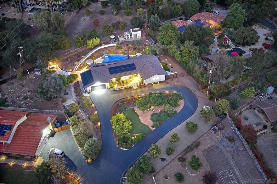 Fresh Pricing! A stunning freshly renovated single level estate set in desirable southwest Escondido, thoughtfully updated with panoramic views. Set in highly desirable southwest Escondido. This gorgeous home is well appointed starting with the interior open floorplan adorned in tasteful high quality engineered wood flooring, new custom light led fixtures and pendant lighting, a new gourmet kitchen fit for an executive chef, desirable Thermador appliances including a built in refrigerator, dual ovens, induction cooktop, custom finished hood/vent, microwave drawer, and custom cabinetry with soft close and dovetail drawers. Featuring 4 bedrooms, the primary suite hosts a new glamorous bathroom with new dual vanity, sitting make up quartz counter, with custom shower enclosure. The secondary bedrooms feature generous room sizes, a secondary bathroom features custom tile flooring, new counters, sinks and light fixtures. A very convenient half bath with custom closet organizers serves the interior guest and outdoor entertaining space. The backyard space with a newly constructed pool and spa, with new decking, a pool house/ADU/casita provide additional changing and retreat space. Fruit and Citrus trees throughout, a freshly paved circular driveway with room for RV parking and guest parking, a newly installed septic system, upgraded electrical panel and solar system. Set on a .69 acre lot, there is no HOA or Mello Roos. A family compound. For those seeking privacy and a family compound. Fresh exterior paint.  Home Upgrades 1. All Newer Electric  2. Newer Roof  3. Upgraded insulation in the attic for prevention of rodents 4. Newer traffic rated commercial grade septic system  5. Newer custom-built kitchen and bathroom cabinets  6. Upgraded appliances (Thermador)  7. Custom hood vent  8. All newer walls   9. Paint on interior and exterior  10. Removed family room wall  11. All newer flooring  12. All newer lighting  13. Ceiling fans throughout  14. Custom California closets in all rooms and hallway closet 15. Recently had dryer vents and chimney inspected (Annual inspection)  16. Pool and Spa  17. Concrete in backyard  18. Garage drywall  19. Landscaping  20. Unpermitted ADU  21. All newer asphalt, circular driveways and down the shared street.  22. Custom countertops 23. Upgraded electrical panel (Approved by SDG&E)  24. Raised living room floors  25. Newer bathroom showers, toilets 26. Newer Sliders, French doors, doors, knobs and installation  27. Front door  28. New Solar System  29. Alarm System with Front Yard Camera 30. Replacement of 3 windows and an additional window in master bath  31. Christmas light outlets at roofline  Room for RV, Boat, 5th wheel. Family Compound