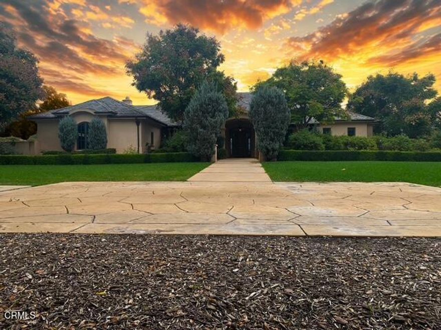 Designed by renowned architect Braden Sterling, this timeless French Provincial estate blends refined craftmanship with the serenity of wide-open Ojai Valley landscapes. Set on 2.1 private usable acres with unobstructed panoramic views of the iconic Topa Topa Mountains, this 4,244 sq ft residence offers five bedrooms, four bathrooms, and every amenity for luxurious indoor-outdoor living.French doors line the back of the home, opening to a resort-style backyard complete with a sparking swimming pool, adjoining spa and cozy fire pit---all framed by rose gardens, raised vegetable beds, and an orchard of mature fruit trees. The property also features two outbuildings, each with a retractable roof, ideal for creative pursuits or flexible workspaces. With room for horses and direct access to the Ojai River Preserve trails and Los Padres National Forest, this is true California living at its finest.Inside, the open, light-filled floorplan showcases high beamed ceilings, tile and hardwood flooring throughout much of the home, and a welcoming chef's kitchen that flows into the great room perfect for entertaining. The indulgent primary suite is a private retreat, featuring dual walk-in closets, serene views, and a spa-like bathroom. Two wings of the home are dedicated to guest or family bedrooms, ensuring privacy and comfort. Three fireplaces add warmth and character, while fire sprinklers throughout provide peace of mind. Additional highlights include a private well, slate roof, and a large storage room off the garage.Quiet, private, and perfectly positioned to capture sunrise and sunset views, this estate is a rare opportunity to own a piece of Ojai serenity.