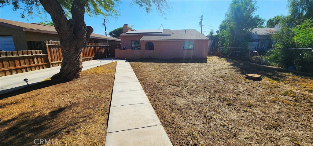 Welcome to this charming property in the heart of Blythe. It’s centrally located within minutes from schools, shopping, local amenities, and is directly across the street from Todd Park. The home itself features 2 bedrooms, 2 bathrooms, upgraded kitchen and bathrooms, bamboo flooring, indoor laundry/utility room, and a wood burning fireplace in the living room. It also comes equipped with all the appliances. Out front is a sizeable fenced yard with sprinkler system. Around back you’ll find a large fenced yard, the perfect size for animals to roam. A lighted workshop provides just enough space to hang your tools and work on outdoor projects. There is a concrete slab for parking your RV, boat, or utility trailer, and RV hook-ups. And did I mention FULLY PAID SOLAR?? This is a first-time home buyer or property investors dream! Come see it and make it yours today!