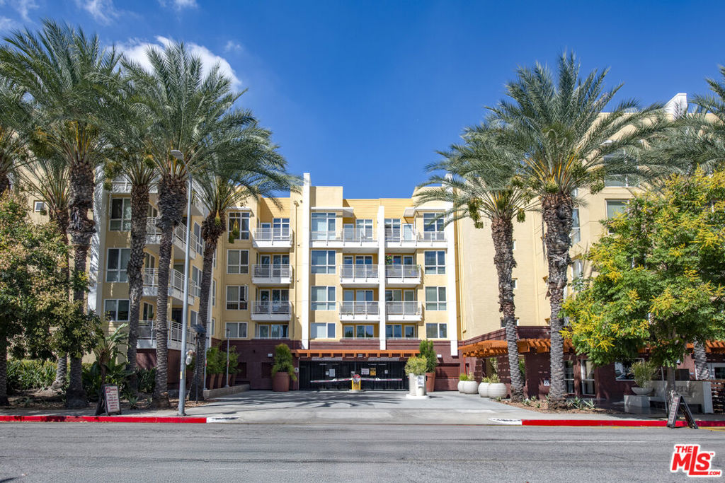 A rare gem at The Ascent of Warner Center, this southeast-facing corner unit is one of only three of its kind in the entire building. Bathed in natural light, the 2 bedroom, 2 bathroom condo features an open floor plan with defined living and dining areas, a large private balcony, and a primary suite with walk-in closet. Designer touches include upgraded cherry wood floors, granite counters, stainless steel appliances, a gas cooktop, and full-size washer and dryer. Two separate parking spaces plus two private storage units add convenience. The resort-style community offers every amenity imaginable: sparkling pool and spa with cabanas, outdoor lounges with fireplaces, fitness center, clubhouse with catering kitchen and entertainment lounge, private dog walk, and lushly landscaped courtyards. Controlled access and gated parking provide peace of mind, while the Promenade Mall, shops, restaurants, and cafes are just moments away. Live like you're on vacation, every single day.