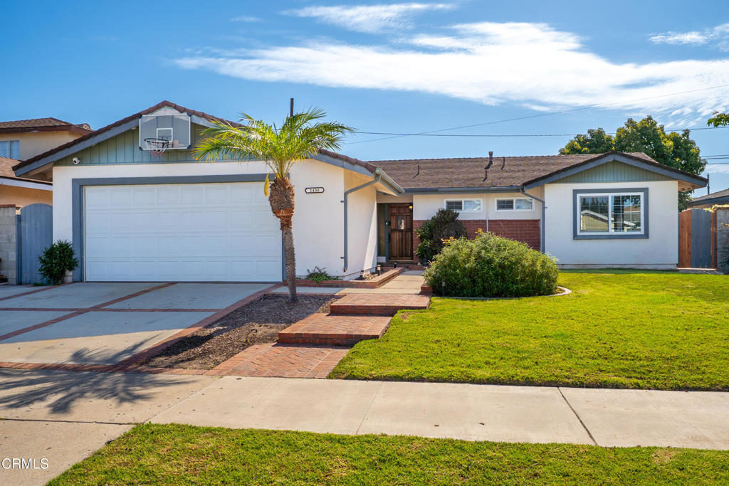 Discover Your Dream Home in one of Oxnard's most sought-after neighborhoods, nestled between Seabridge and Oxnard Beaches. This stunning single-story residence offers the perfect blend of modern updates and comfortable living, with four spacious bedrooms and a thoughtfully designed open floor plan, creating an effortless flow that's ideal for both everyday living and entertaining. The heart of the home features a beautifully appointed kitchen with premium quartz countertops, classic subway tile backsplash, and elegant glass-front cabinetry. A convenient wine storage area and charming farmhouse sink complete the space, which opens seamlessly to the dining area. The inviting living room showcases a striking brick fireplace, sophisticated recessed lighting, and French doors that connect indoor and outdoor living. Thoughtful Bedroom & Bath DesignThe front-positioned primary suite offers privacy and comfort with its own ensuite bathroom featuring custom shower details. The updated guest bathroom boasts modern fixtures, vanity, and lighting. Throughout the home, you'll find attractive wood-look tile in common areas and quality laminate flooring in all bedrooms. Energy-efficient dual-pane windows, smooth ceiling finishes, and carefully selected materials throughout demonstrate the quality and care invested in this property. Step outside to your personal retreat featuring a beautiful pergola perfect for al fresco dining and entertaining, complemented by manicured grassy areas for relaxation and play. This home is ready for immediate move-in, this meticulously maintained home won't last long in today's market!