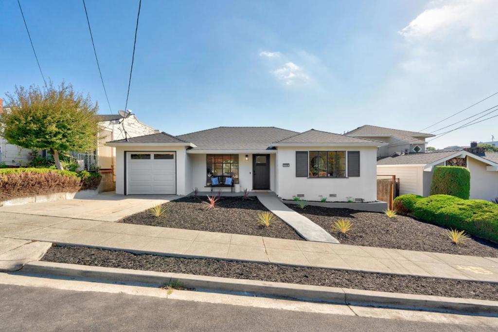 Welcome to this stunning single-family home in the desirable Huntington Park neighborhood of San Bruno. This 3 bedroom, 1 bath residence has been extensively remodeled with modern finishes and custom details. Step inside to discover beautiful hardwood flooring and fresh interior paint that create a warm and inviting atmosphere. The light-filled living room features a wall of windows! The dining area flows effortlessly between the living room and rear entertainment deck. The gourmet kitchen, completed August 2025, is a chef's dream, boasting sleek quartz countertops, custom J&K cabinetry, and stainless steel appliances highlighted by a gas range. The bathroom has been tastefully updated with contemporary fixtures and designer touches. Attached one-car garage with a dedicated laundry area. Outside, the spacious backyard provides plenty of room for entertaining or relaxing in the California sunshine with low maintenance landscaping and a large, newly installed turf area. Other 2025 upgrades include roof, sewer lateral replacement, termite clearance and much more! Located near schools, parks, and shopping, with easy access to major highways, this home offers both convenience and luxury. Don't miss this rare opportunity to own a meticulously updated home in San Bruno!