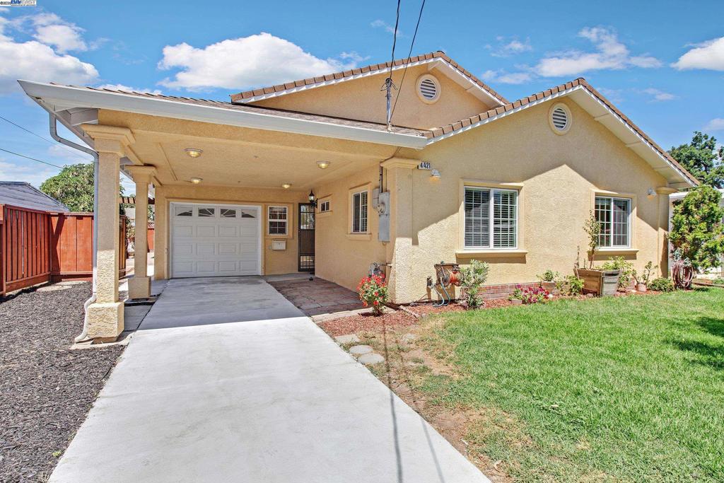 Beautifully updated 4-bedroom, 3-bathroom home with approx. 1,484 sq. ft. of living space (per public records), ideal for flexible living. Located in the South Sundale neighborhood of Fremont, this home is part of the Fremont Unified School District. The vaulted ceiling living room is filled with natural light from skylights and oversized dual-pane windows, complemented by recessed lighting and an open layout. Perfect for remote work or multi-generational households, the home offers a versatile floor plan with a bonus room in the converted garage. The primary suite serves as a private retreat with a vaulted ceiling, skylight, and a luxurious jetted tub. Tile flooring in common areas and laminate in bedrooms provide durability and style. The kitchen flows into a spacious backyard designed for entertaining, featuring a trellis-covered patio and a custom BBQ station with grill, sink, and mini fridge. A dedicated laundry room with its own full bath adds convenience. Ample parking includes a carport and long driveway. Buyer to verify square footage and permits.
