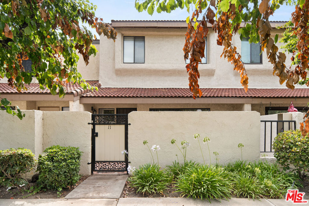 Live the lifestyle you deserve in this beautifully updated 3 bedroom, 3 bathroom townhouse located in the heart of Encino Village, one of the most sought after communities in the area. Spacious and filled with natural light, this home seamlessly blends modern style with practical comfort, offering an ideal setting for everyday living and effortless entertaining. Step inside to discover newly refinished hardwood and laminate flooring, fresh paint throughout, recessed lighting, and a striking granite stone fireplace that adds warmth and character. The kitchen features fresh quartz countertops and classic plantation shutters, while the adjacent den and elevated formal dining room with built-in wet bar create inviting spaces for gathering and relaxing.The expansive primary suite serves as a true retreat, featuring vaulted ceilings, dual closets, and a luxurious bathroom complete with a jacuzzi tub. Two additional bedrooms offer versatile options for guests, home offices, or growing families.A private patio provides the perfect spot for morning coffee or weekend entertaining. The home also includes direct access to a two car garage with built-in storage, along with ample guest parking for added convenience. As a resident of Encino Village, you'll enjoy exclusive access to premium amenities including two swimming pools, a spa, sauna, fully equipped gym, recreation room, and two racquetball courts. Every detail supports a lifestyle of comfort and connection.This turnkey townhouse combines generous space, refined finishes, and exceptional community features in a prime Encino location. Now available and ready for immediate move-in. Schedule your tour today and discover your next home.