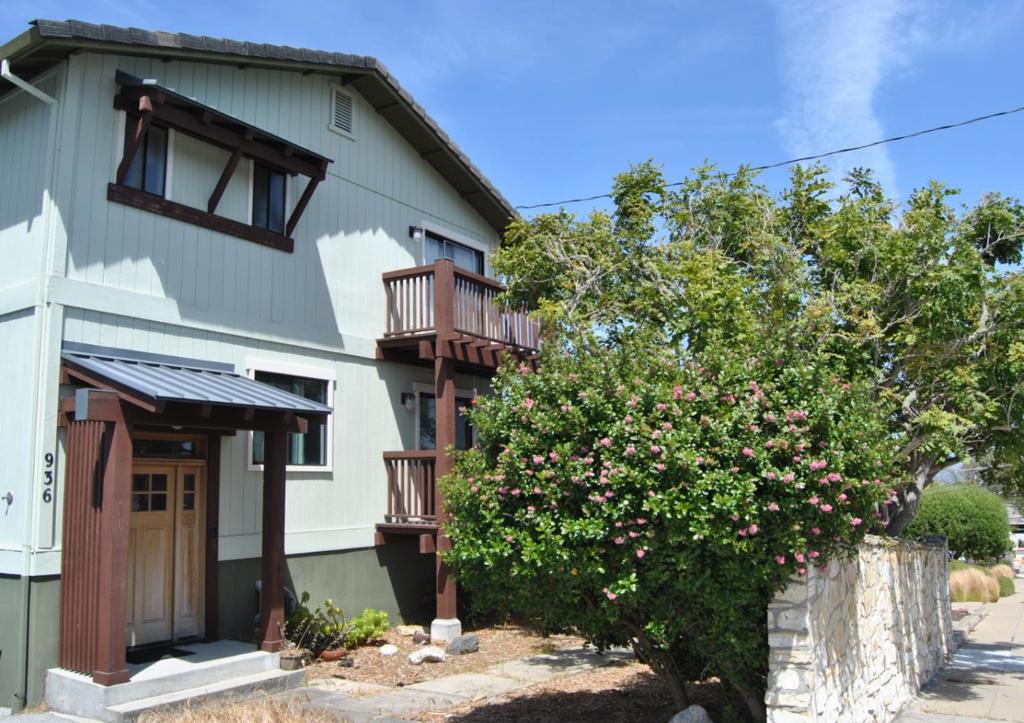 Stunning Monterey Bay Views Charming coastal living just steps from town! This 3-bedroom, 2.5-bath home offers 2,240 sq ft of comfortable living space, featuring beautiful hardwood floors, a cozy fireplace, and an open layout perfect for entertaining. Enjoy stunning views of Monterey Bay from inside and the expansive wood decks, ideal for relaxing or hosting guests. The property also includes a spacious two-car garage and is located in a highly desirable neighborhood where you can easily walk to shops, restaurants, and local attractions. A perfect blend of convenience, views, and charm awaits!