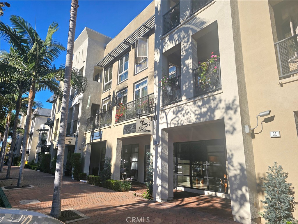 Welcome to 35 Vantis located in City Walk — an elegant, light-filled townhome offering exceptional space. This 3-bedroom, 2.5-bath residence spans approximately 2,200 sq. ft. across the second and third floors and is designed for modern living and entertaining. Floor-to-ceiling windows and multiple balconies capture city lights and mountain panoramas, creating a bright, open atmosphere throughout. The gourmet kitchen is appointed with top-of-the-line appliances and tasteful upgrades, perfect for everyday meals and entertaining. The open, flowing layout centers on a generous family/dining area enhanced by recessed lighting, fireplace and a large balcony that extends your living space outdoors. The primary suite is a private retreat with an oversized soaking tub, dual sinks, a substantial walk-in closet and its own balcony. The two secondary bedrooms are quite good size and share a bathroom. Community amenities elevate everyday living with a clubhouse, game room, swimming pool, spa and tot lot. The Commons and the Aliso Viejo Town Center are a short drive away offering everything from Trader Joe's, Ralph's, CVS, TJ Maxx, the new 99 Ranch Market and several other restaurants and shops. Elementary, middle, high school and Soka University are are a short distance from the property. The unit is ideally located minutes from Laguna Beach, Irvine Spectrum and major freeways.— this townhome blends convenience with resort-style community living.